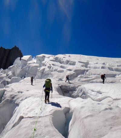 crossing crevasses on glacier