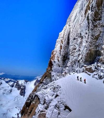 climbers walking on snow
