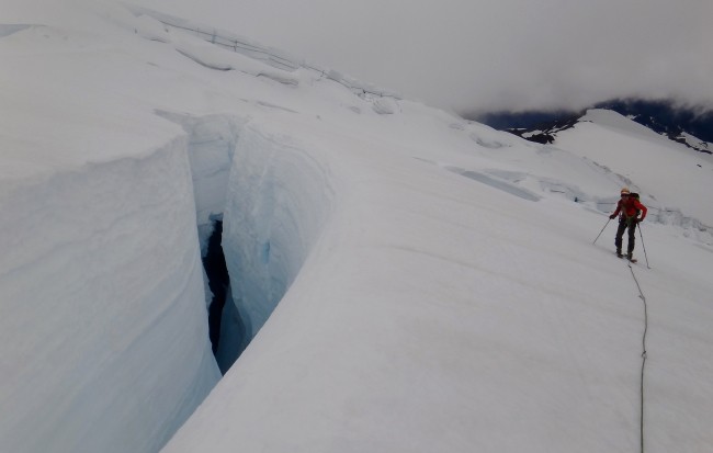 crossing crevasses on glacier