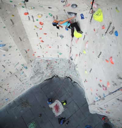 Girl rock climbing indoor gym