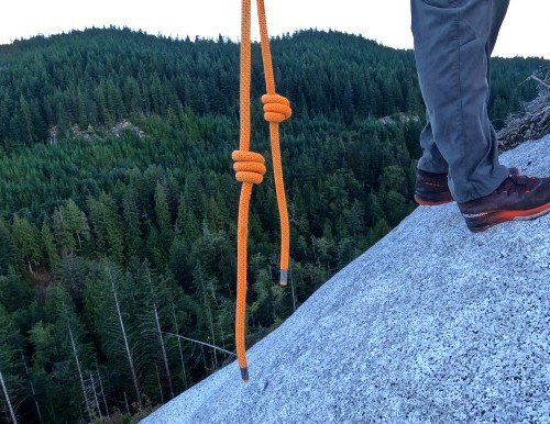 Tie knots in the end of climbing ropes for rappelling