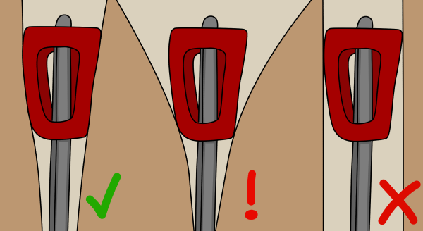 Rock climbing nuts placed in a crack in different orientations